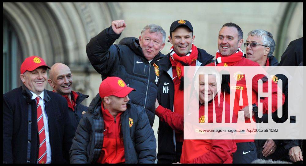 Sir Alex Ferguson takes a picture on his Mobile phone of the fans in Albert Square, Manchester, As Manchester United celebrate winning their 20th league title winning the Premier League, Monday May 13, 2013. AndrewxParsonsx xi-Images AJP