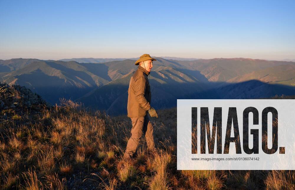 Russia Putin Leisure 6659761 26.09.2021 Russian President Vladimir Putin walks during his leisure time in the Siberian Federal District, Russia. Alexei Druzhinin Sputnik Russia