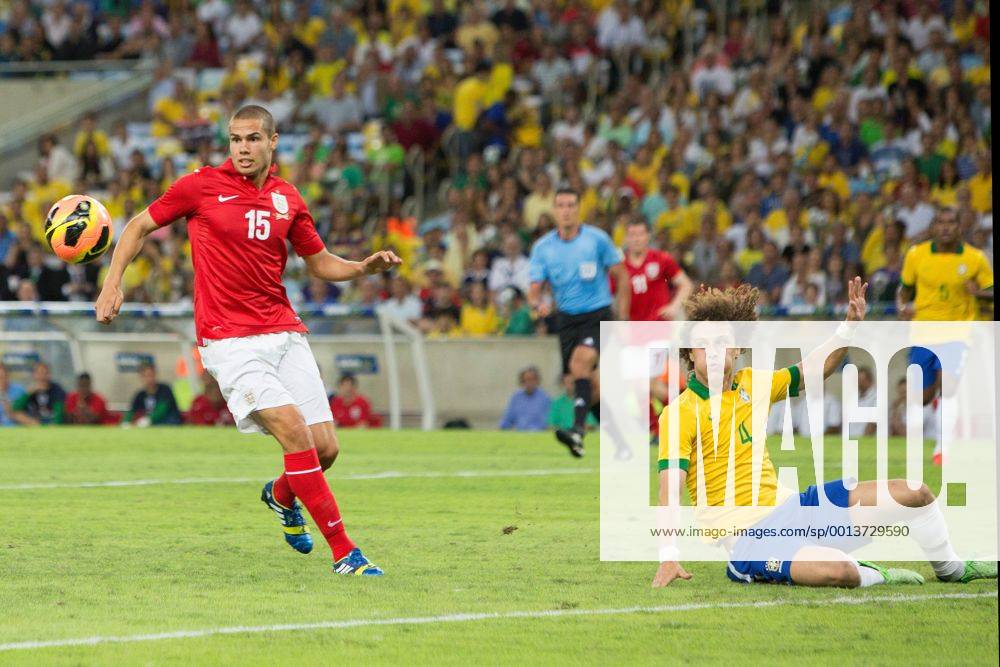 Football - International Friendly - Brazil vs. England David Luiz of Brazil fails to clear a crossed ball but Jack Rodwell of England cannot capitalise at the Maracana Stadium, Rio de Janeiro