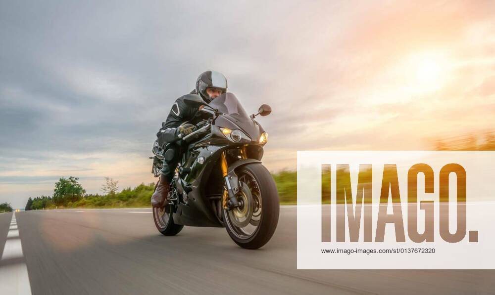 Motorbike on the road riding. having fun riding the empty road on a motorcycle tour / journey model released, Symbolfoto, 13.10.2020,