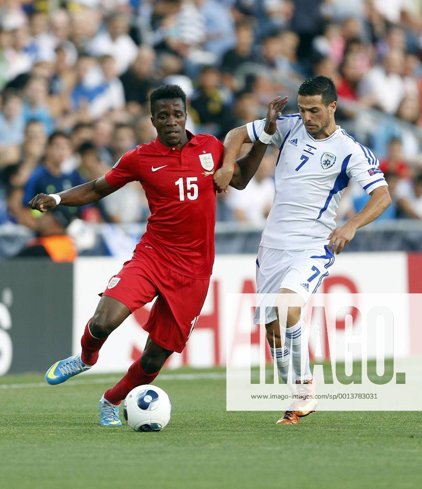 Israel s Israel Zaguri tussles with England s Wilfred Zaha - Israel U21 vs England U21 - UEFA U21 Championship 2013 - Teddy Stadium - Jerusalem - Israel - 11 06 2013 - Pic David Klein Sportimage .