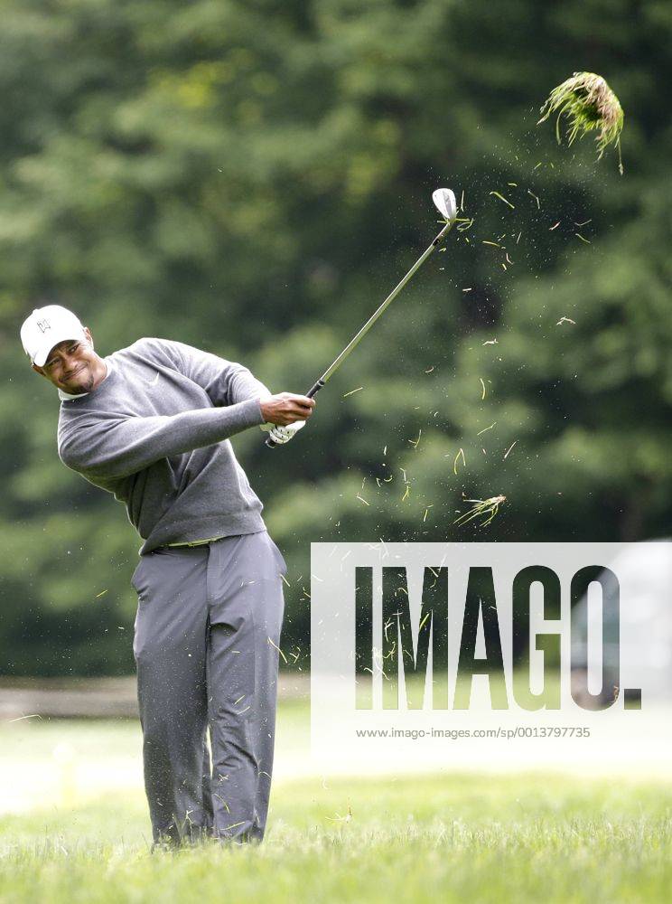 Tiger Woods hits a ball out of the rough on the 12th hole in the second round at the 113th U.S. Open at Merion Golf Club in Ardmore, Pennsylvania on June 14, 2013. PHI20130614105
