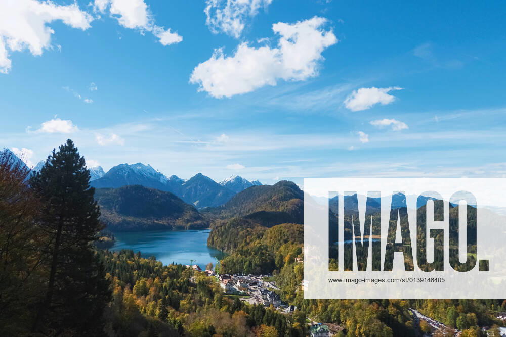 Beautiful nature of European Alps, landscape view of alpine mountains, lake and village on a sunny day, travel and destination Beautiful nature of European Alps, landscape view of alpine mountains, lake and village on a sunny day, travel and destination scenery
