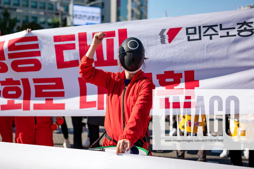 General Strike Of The Korean Confederation Of Trade Unions In Seoul A member of the Korean Confederation of Trade Unions wears mask costumed in the Netflix series Squid Game for a march to Seoul City hall during a rally against the government s labor policy on October 20, 2021 in Seoul, South Korea. Thousands of union members hold a massive rally in Seoul as an one-day strike aimed at bringing labor issues to the next presidential election in 2022. Seoul South Korea