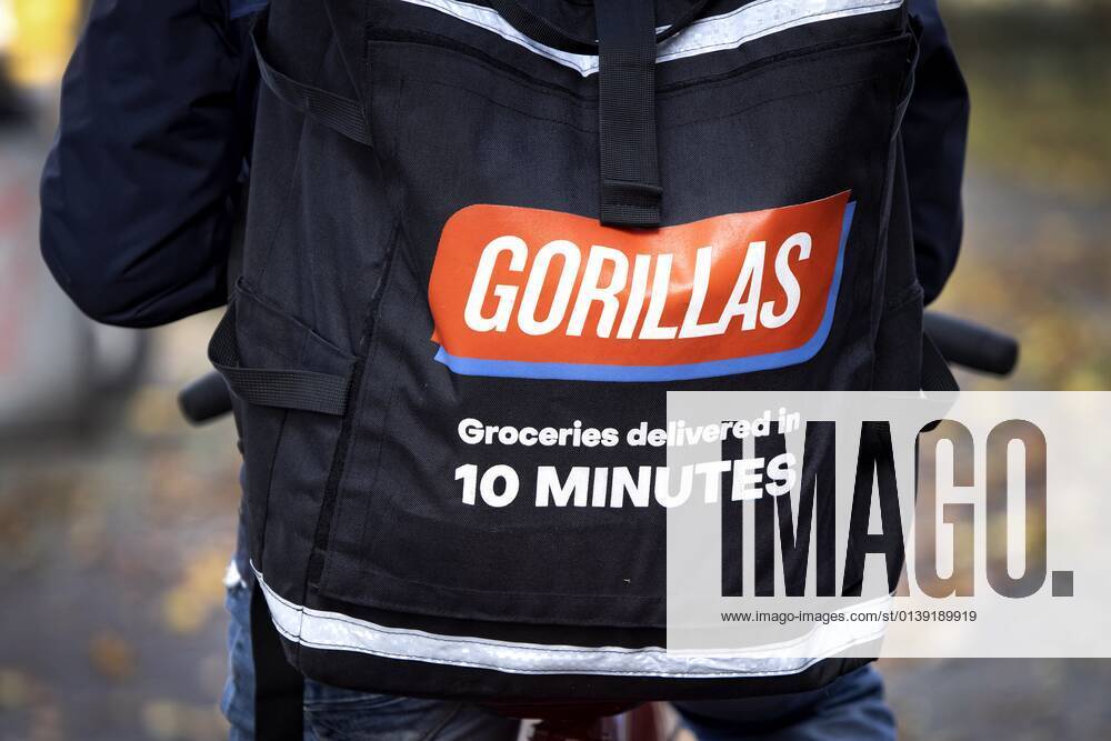 AMSTERDAM - A flash deliverer of gorillas en route in Amsterdam. ANP RAMON VAN FLYMEN
