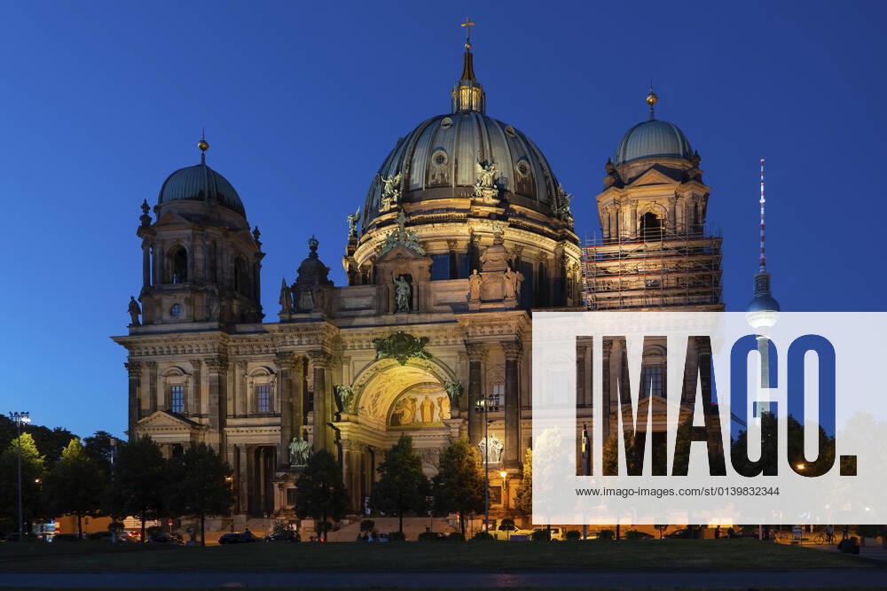 Germany, Berlin, Facade of Berlin Cathedral at night with Berlin Television Tower in background ABOF00716
