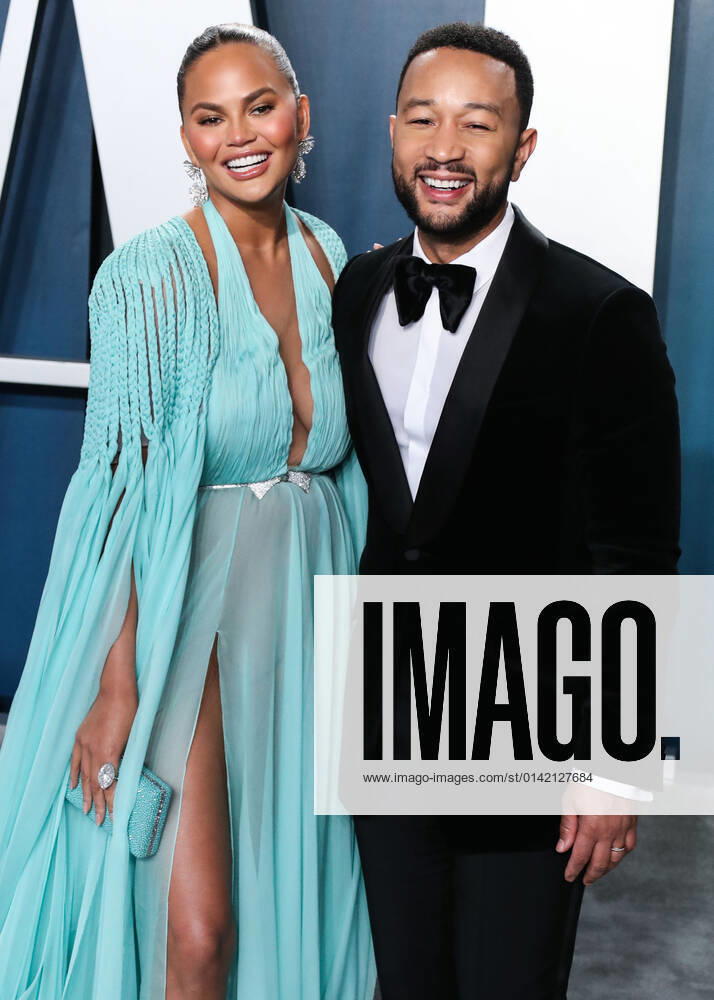 2020 Vanity Fair Oscar Party Model Chrissy Teigen wearing a Georges Hobeika â£dress, Giuseppe Zanotti heels, Heliopolis clutch and Lorraine Schwartz jewelry and husband singer John Legend arrive at the 2020 Vanity Fair Oscar Party held at the Wallis Annenberg Center for the Performing Arts on February 9, 2020 in Beverly Hills, Los Angeles, California, United States. Beverly Hills California United States