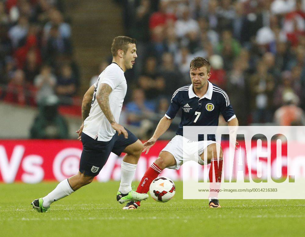 England s Jack Wilshere tussles with Scotland s James Morrison England v Scotland - International Friendly - Wembley - London - England -14 08 2013 - Pic DavidxKlein Sportimage .