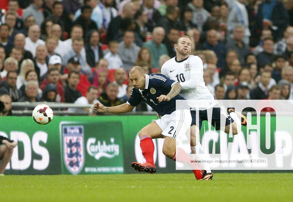 England s Wayne Rooney tussles with Scotland s Alan Hutton England v Scotland - International Friendly - Wembley - London - England -14 08 2013 - Pic DavidxKlein Sportimage .