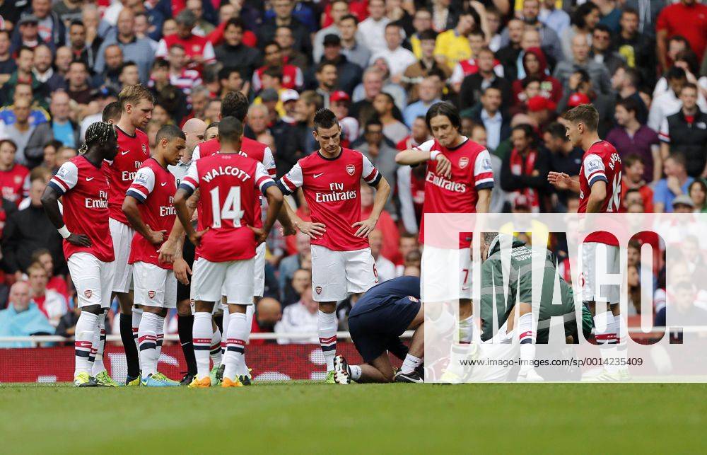 Arsenal s players look on dejected after Kieron Gibbs gets injured - FC Arsenal London v Aston Villa FC - Barclays Premiership - Emirates Stadium - London - England -17 08 2013 - .