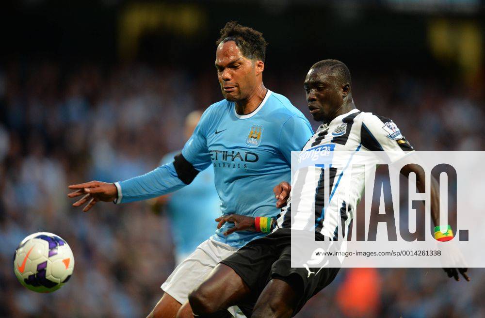 Joleen Lescott of Manchester City tussles with Papiss Demba Cisse of Newcastle United - Barclays Premier League - Manchester City vs Newcastle Utd - Etihad Stadium - Manchester - England - 19 08 13 - Picture Simon Bellis Sportimage .