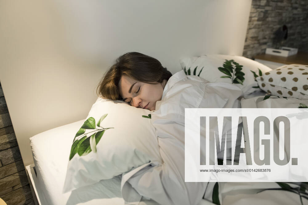 Woman sleeping in bed at home model released property released, LLUF00271