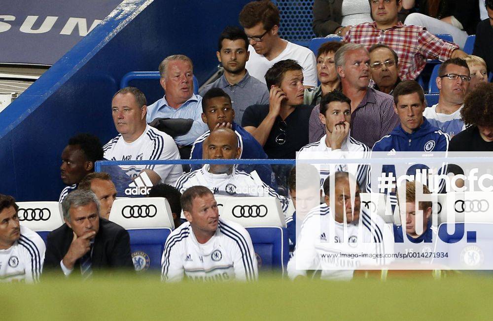 Chelsea s Fernando Torres dropped from the squad watches the match behind Jose Mourinho Chelsea FC London v Aston Villa - Barclays Premiership - Stamford Bridge - London - England -21 08 2013 - Pic David Klein Sportimage .