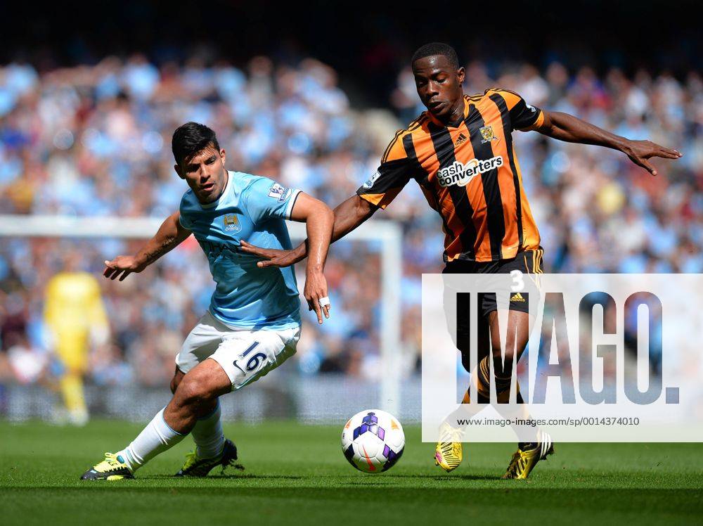 Sergio Kun Agüero of Manchester City is knocked off the ball by Maynor Figueroa of Hull City - Barclays Premier League - Manchester City vs Hull City - Etihad Stadium - Manchester - England - 31 08 13 - .