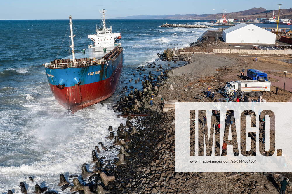SAKHALIN REGION, RUSSIA – DECEMBER 7, 2021: Rescuers evacuate crew members of the Chinese dry bulk carrier Xing Yuan that has run aground off the port town of Kholmsk. Sergei Krasnoukhov TASS TS11AEED