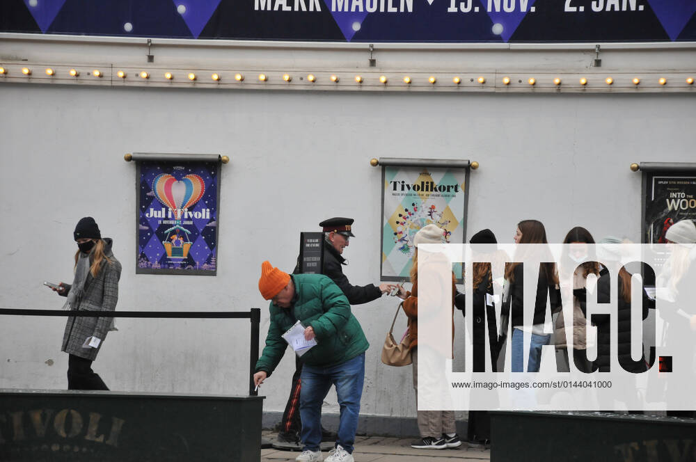 Copenhagen Denmark. 07 December 2021 Tvoli garden christmas visitor showing corona passport at enterance in danis capiatl (Photo..Francis Joseph Dean Dean Pictures)