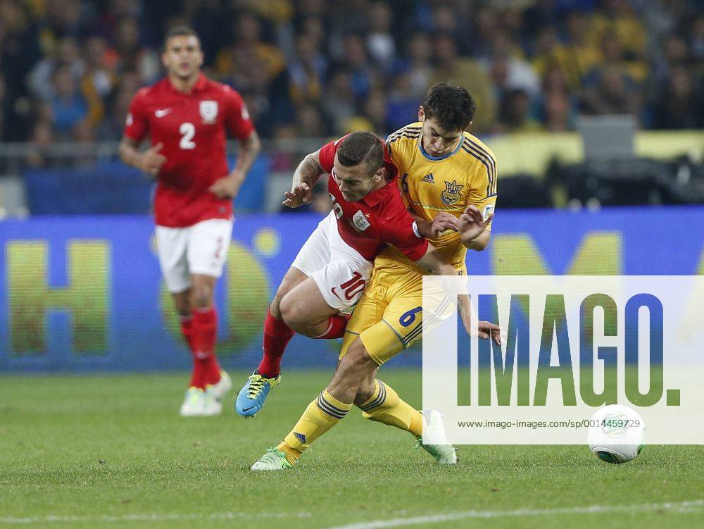 Ukraine s Taras Stepanenko tussles with England s Jack Wilshere Ukraine v England - 2014 World Cup Qualifier - Olympic Stadium - Kiev - Ukraine -10 09 2013 - Pic David Klein Sportimage .