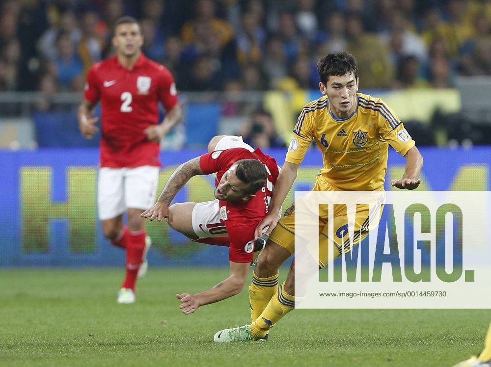 Ukraine s Taras Stepanenko tussles with England s Jack Wilshere Ukraine v England - 2014 World Cup Qualifier - Olympic Stadium - Kiev - Ukraine -10 09 2013 - Pic David Klein Sportimage .