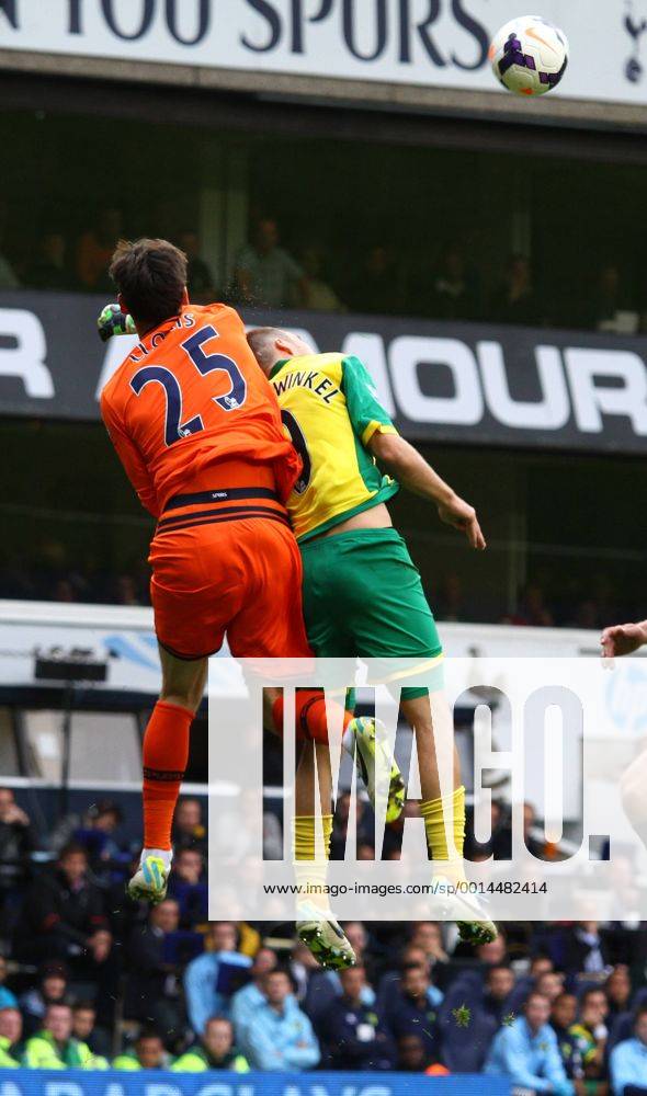 Tottenham Hotspur v Norwich City . . London, UK . . 14.09.2013 Hugo Lloris (TH) clatters into Ricky van Wolfswinkel (NC)
