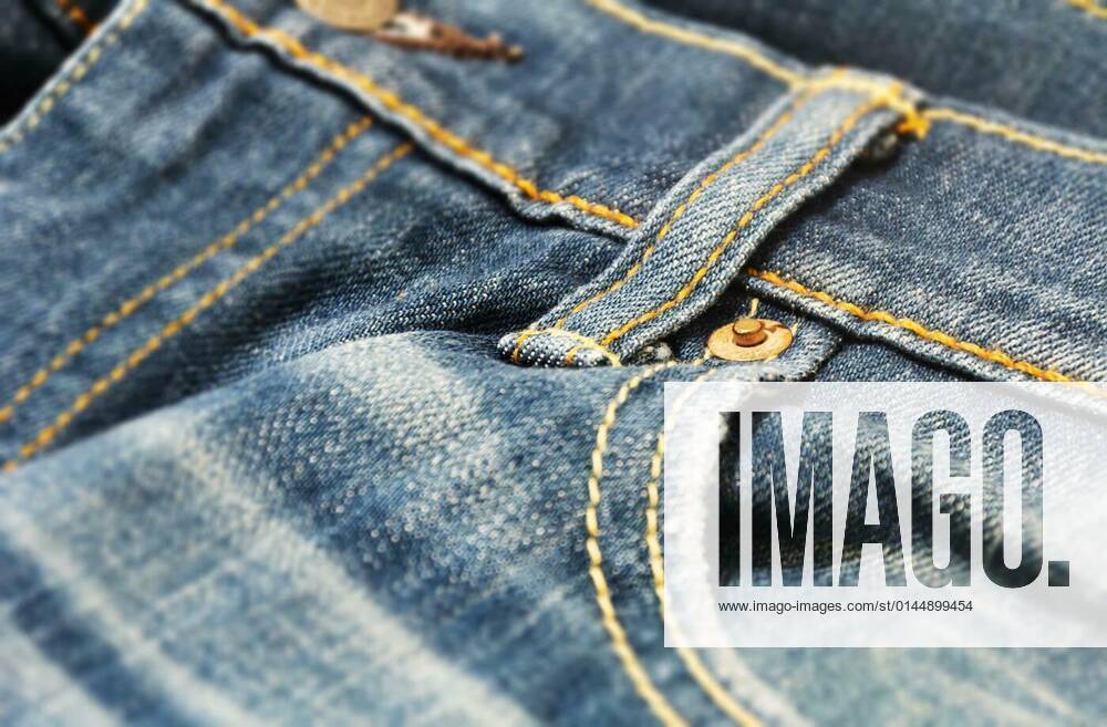 Close-up view of the copper rivet on the pocket of a pair of denim trousers, 25.10.2021,