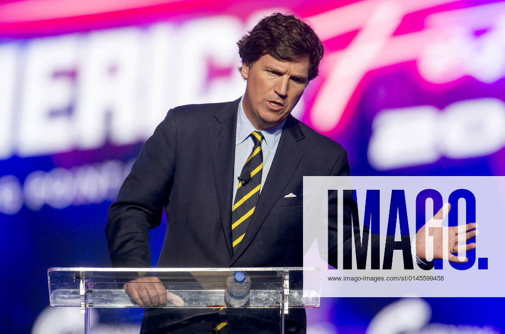 Phoenix, Arizona, USA - Fox News host TUCKER CARLSON speaks at AmericaFest, a Turning Point USA event. Phoenix USA - ZUMAce6_ 20211219_zaf_ce6_010