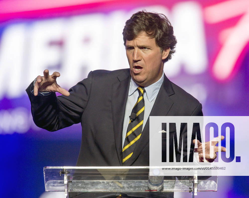 Phoenix, Arizona, USA - Fox News host TUCKER CARLSON speaks at AmericaFest, a Turning Point USA event. Phoenix USA - ZUMAce6_ 20211219_zaf_ce6_011