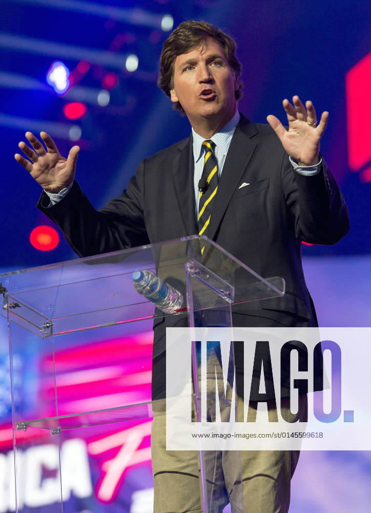 Phoenix, Arizona, USA - Fox News host TUCKER CARLSON speaks at AmericaFest, a Turning Point USA event. Phoenix USA - ZUMAce6_ 20211219_zaf_ce6_017