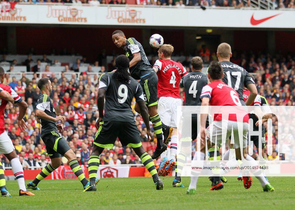 Arsenal s Per Mertesacker scoring his sides second goal Arsenal v Stoke - Barclays Premier League- Emirates Stadium - London - England -22 09 2013 - .