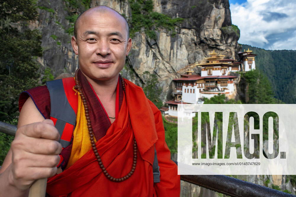 Monk in the Taktsang Goemba or Tigers nest monastery in Paro valley, Bhutan, Asia. Paro Taktsang or Taktsang Palphug Monastery and the Tiger s Nest is a prominent Himalayan Buddhist sacred site and the temple complex is located in the cliffside of the upper Paro valley in Bhutan. A temple complex was first built in 1692, around the Taktsang Senge Samdup cave where Guru Padmasambhava is said to have meditated for three years, three months, three weeks, three days and three hours in the 8th century. Bhutan
