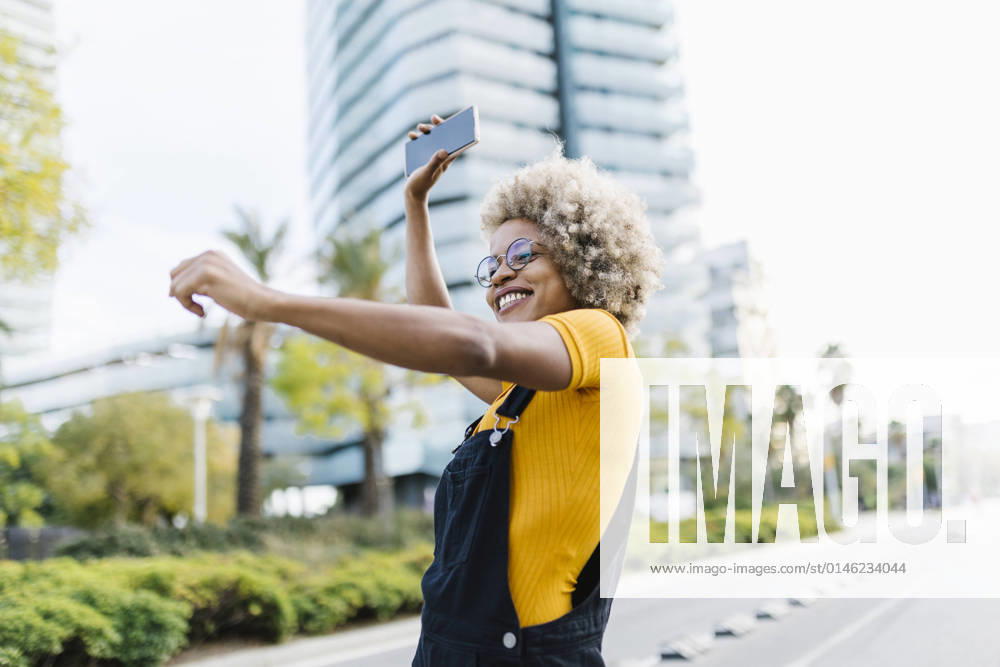 Woman holding mobile phone and dancing on road model released, XLGF02462