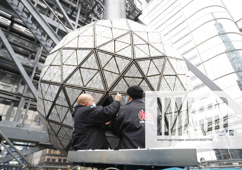 Workers install 192 sparkling, new Waterford Crystal triangles featuring this year s Gift of Wisdom design on the Times Square New Year s Eve Ball in New York City on Monday, December 27, 2021. NYP20211227105 JohnxAngelillo
