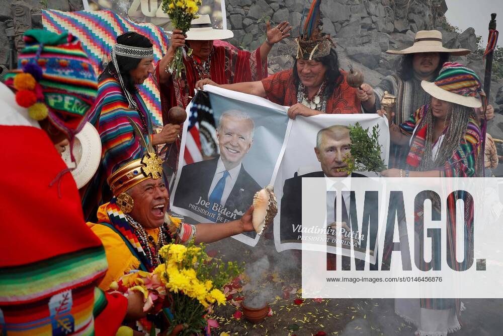 Peruvian shamans and healers hold pictures of the President of USA, Joe Biden (C-L), and his counterpart of Russia, Vladimir Putin, during the ceremony in which they make their predictions for 2022, in Lima, Peru, 29 December 2021. Shamans and healers from Peru meet this Wednesday on the San Cristobal hill, the most sacred in Lima since pre-Hispanic times, to make their predictions for the year 2022 in a ritual with hallucinogenic plants such as ayahuasca and San Pedro. Shamans of Peru make their predictions for 2022 !ACHTUNG: NUR REDAKTIONELLE NUTZUNG!