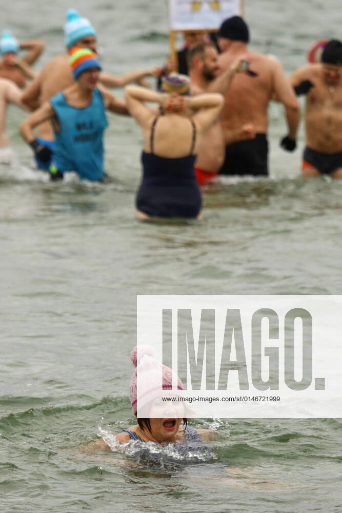 New Year s Cold Water Swim In Baltic Sea A woman reacts as she enters the ice cold waters of the Baltic Sea in Gdansk, Poland on 01 January, 2022. About a hundred people took part in the traditional New Year s swim in the Baltic Sea braving the ice cold waters. Gdansk Poland