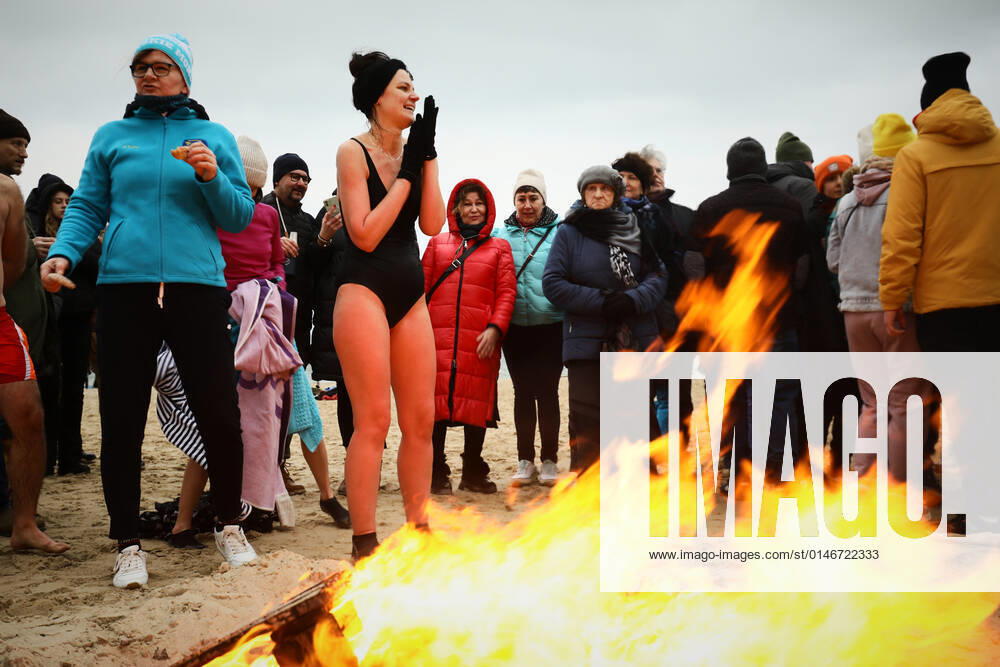 New Year s Cold Water Swim In Baltic Sea A woman warms up by a fire after a cold water swi in the Baltic Sea in Gdansk, Poland on 01 January, 2022. About a hundred people took part in the traditional New Year s swim in the Baltic Sea braving the ice cold waters. Gdansk Poland