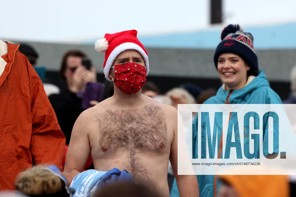 Over 350 New Year revellers, many in fancy dress, take part in the New Year Big Dip at East Wittering Beach in Chichester, West Sussex. More than double the previous record number of people took part, making the most of the warmest New YearÕs Day on record in the UK. JANUARY 1st 2022 MTXx2201