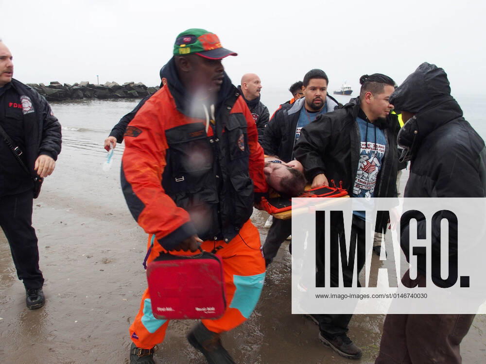 January 1, 2022 New York , Coney Island Polar Bear Plunge. This year the Polar Bear Plunge returned after last year s Covid outbreak. Revelers enjoy the water..Participant prior to massive cardiac event and Emergency medical personnel try and revive him before transporting him to area hospital. New York USA - ZUMAct2_ 20220101_zaf_ct2_094