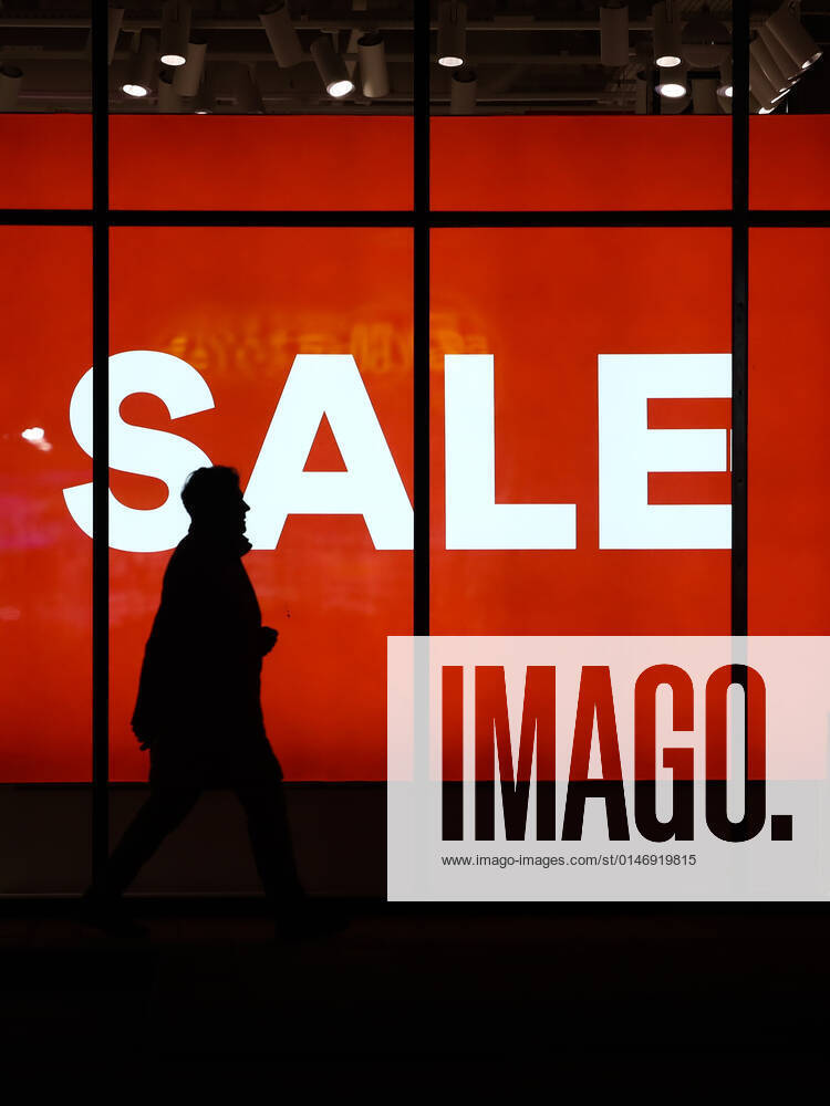 International Brands In Poland A person passes by a sale sign displayed at the store window in Andrychow, Poland on January 3, 2022. Krakow Poland