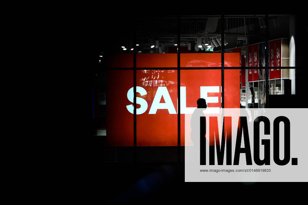 International Brands In Poland A person passes by a sale sign displayed at the store window in Andrychow, Poland on January 3, 2022. Krakow Poland