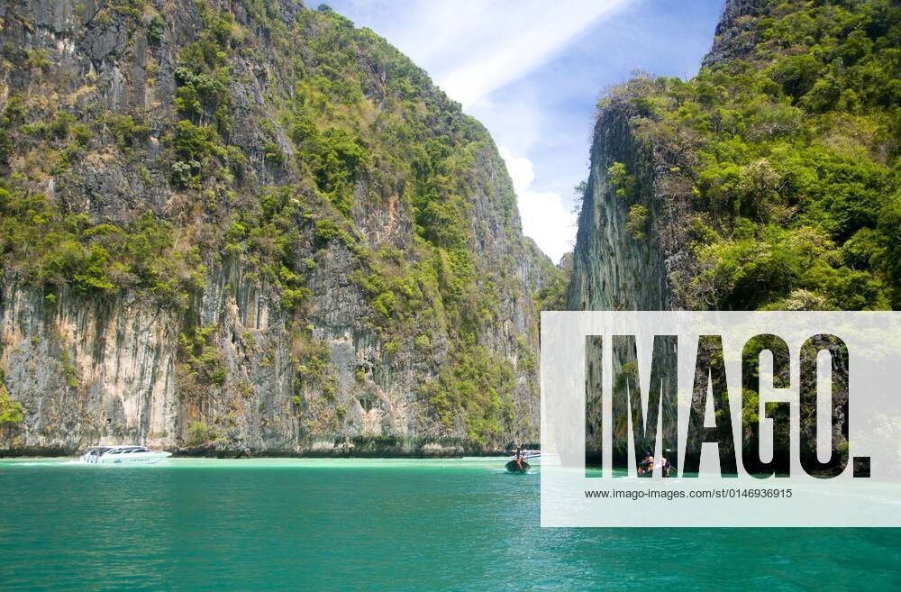 Ko Phi Phi consists of two islands, Phi Phi Leh and Phi Phi Don, located southeast of Phuket. Both are part of Hat Noppharat Thara Ko Phi Phi National Marine Park.<br ><br > Set in the centre of the Sea of Phuket, Ko Phi Phi is almost equidistant from Phuket and Krabi and can be reached by boat in around two hours.<br ><br > Phi Phi Don is the larger of the two islands, with scenic hills, steep cliffs, silken beaches, azure waters and remarkable bird- and sea-life. The island narrows at the middle where long, white-sand beaches are only a few hundred metres apart. Boats from Krabi and Phuket dock at Ao Ton Sai on the southern side of the island. Hat Yao or Long Beach faces south and is famous for the good snorkelling to be had on its co CPAxMediaxCo.xLtd. 1060_14_CPA0011464
