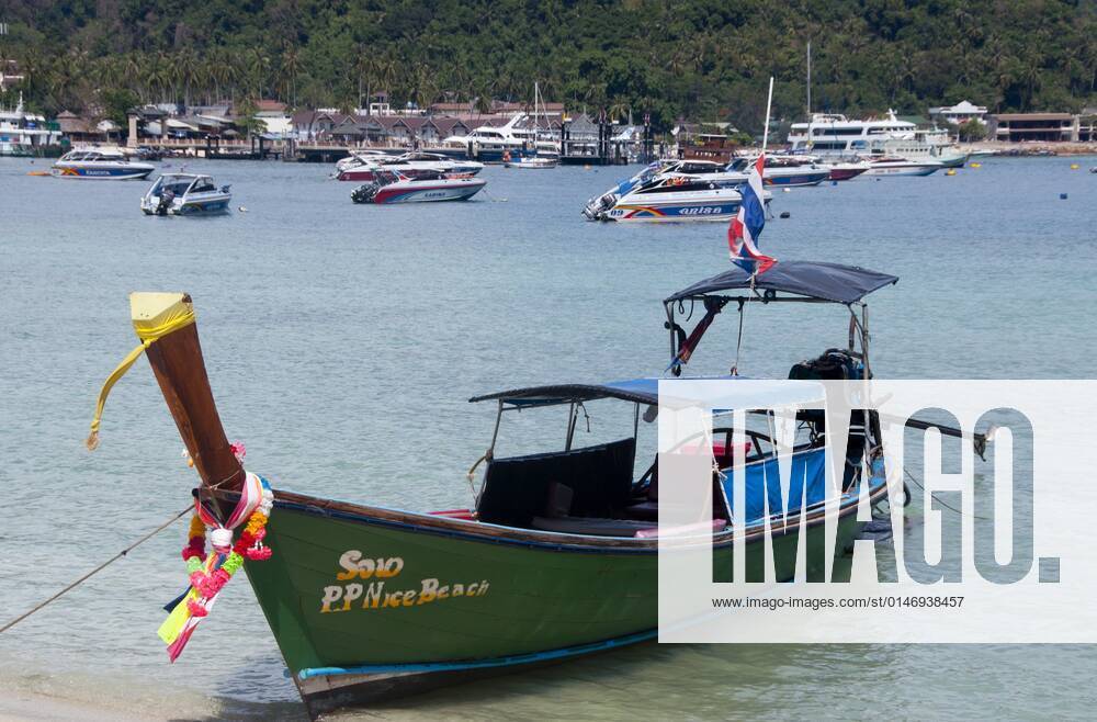 Ko Phi Phi consists of two islands, Phi Phi Leh and Phi Phi Don, located southeast of Phuket. Both are part of Hat Noppharat Thara Ko Phi Phi National Marine Park.<br ><br > Set in the centre of the Sea of Phuket, Ko Phi Phi is almost equidistant from Phuket and Krabi and can be reached by boat in around two hours.<br ><br > Phi Phi Don is the larger of the two islands, with scenic hills, steep cliffs, silken beaches, azure waters and remarkable bird- and sea-life. The island narrows at the middle where long, white-sand beaches are only a few hundred metres apart. Boats from Krabi and Phuket dock at Ao Ton Sai on the southern side of the island. Hat Yao or Long Beach faces south and is famous for the good snorkelling to be had on its co CPAxMediaxCo.xLtd. 1060_14_CPA0014902