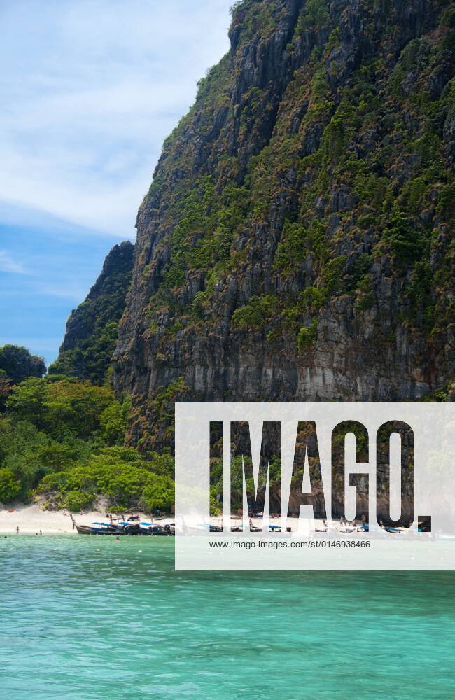 Ko Phi Phi consists of two islands, Phi Phi Leh and Phi Phi Don, located southeast of Phuket. Both are part of Hat Noppharat Thara Ko Phi Phi National Marine Park.<br ><br > Set in the centre of the Sea of Phuket, Ko Phi Phi is almost equidistant from Phuket and Krabi and can be reached by boat in around two hours.<br ><br > Phi Phi Don is the larger of the two islands, with scenic hills, steep cliffs, silken beaches, azure waters and remarkable bird- and sea-life. The island narrows at the middle where long, white-sand beaches are only a few hundred metres apart. Boats from Krabi and Phuket dock at Ao Ton Sai on the southern side of the island. Hat Yao or Long Beach faces south and is famous for the good snorkelling to be had on its co CPAxMediaxCo.xLtd. 1060_14_CPA0014907