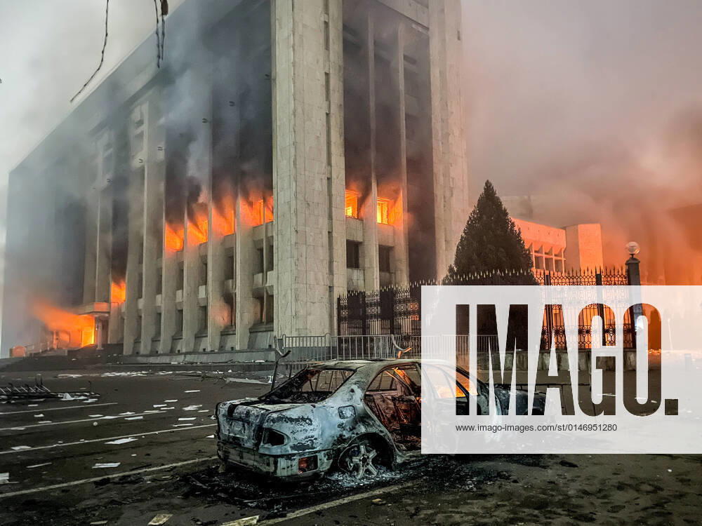 A burnt car is seen by the mayorâ€s office on fire. Protests are spreading across Kazakhstan over the rising fuel prices; protesters broke into the Almaty mayorâ€s office and set it on fire. Valery Sharifulin TASS TS11E1C1