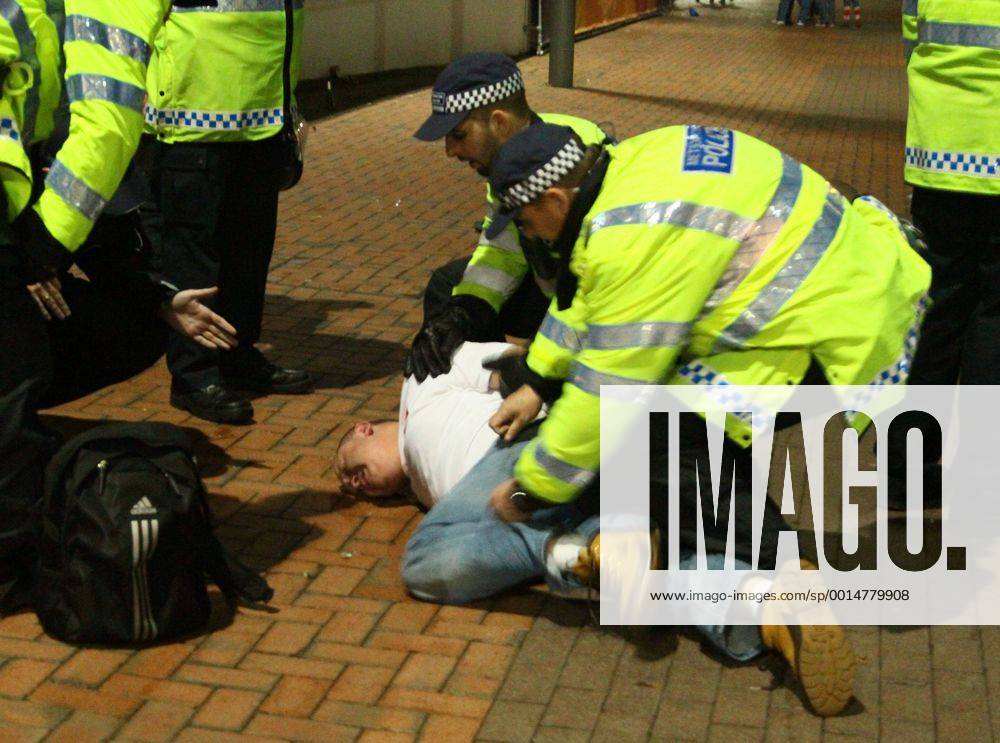 Poland - World Cup Qualifier . . Wembley, London . . 15.10.2013 A Polish fan is restrained by police outside Wembley Stadium.