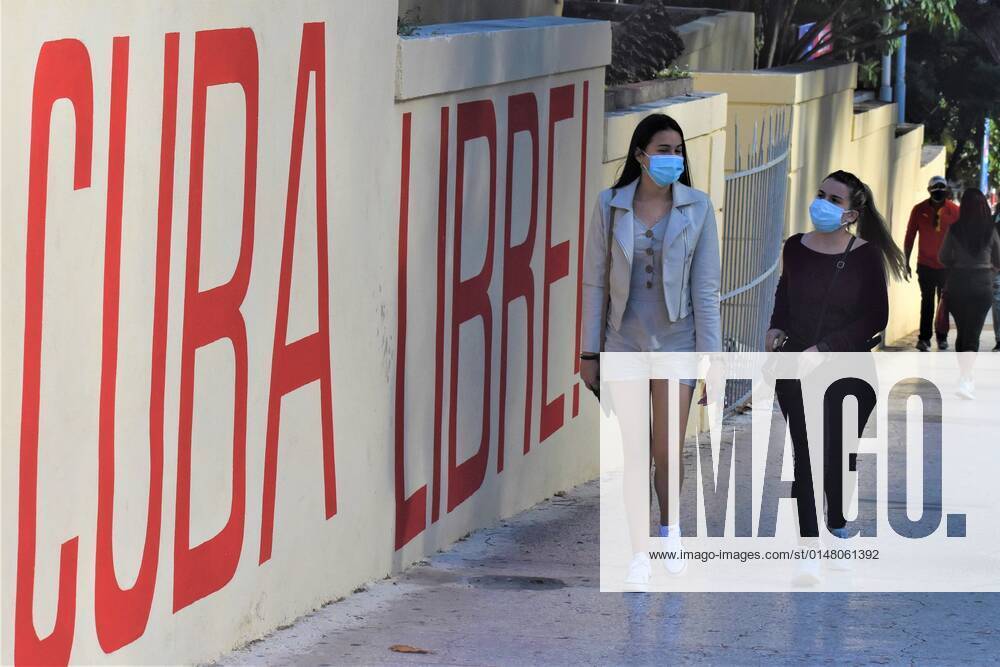 (220118) -- HAVANA, Jan. 18, 2022 -- People wearing face masks walk on a street in Havana, Cuba, Jan. 17, 2022. The Cuban government has announced new protocols for COVID-19 hospitalization as the country s COVID-19 caseload surpassed 1 million on Monday. The Caribbean nation on Monday registered 3,306 confirmed cases and one more virus-related death, taking the national counts to 1,002,499 and 8,341 respectively, said the country s Health Ministry. ) CUBA-COVID-19-CASES ZhuxWanjun