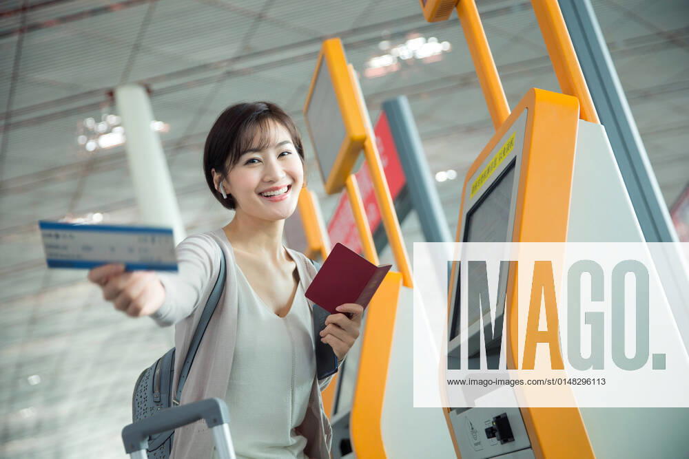 Business lady in the airport to use automatic machines China, 12 04 2019, model released,