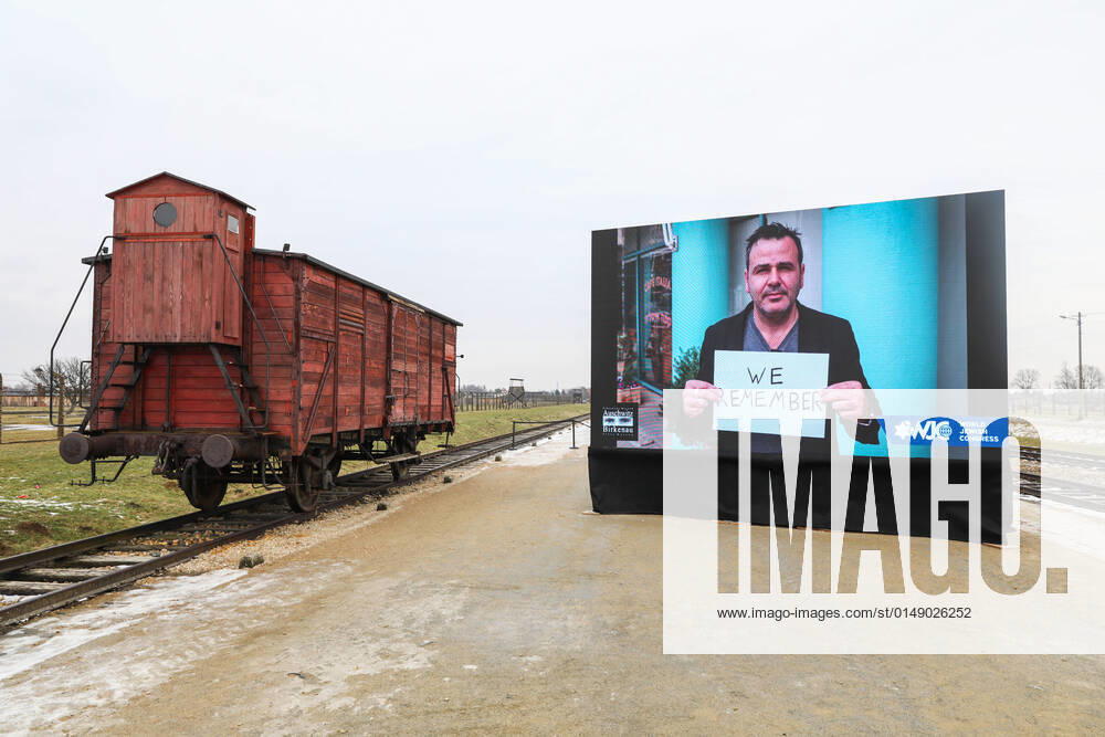 77th Anniversary Of Auschwitz - Birkenau Liberation An original railway carriage used for deportations and a screen showing videos of World Jewish Congress for the 77th Anniversary of Auschwitz - Birkenau Liberation are seen at the former Nazi-German Auschwitz II-Birkenau concentration and extermination camp in Brzezinka near Oswiecim, Poland on January 27, 2022. OÅ›wiÄcim Poland