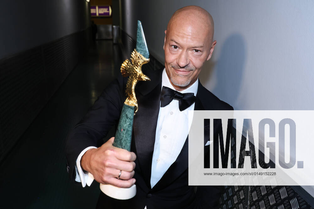 Fyodor Bondarchuk accepts his Golden Eagle Award for the 2021 Bondarchuk Battle documentary during the 20th ceremony for the Golden Eagle National Film Awards held at Mosfilm pavilion No 1. Established by the Russian National Academy of Motion Pictures Arts and Sciences, this annual award marks outstanding filmmaking achievements in 2021, given by a vote of the academy s full and associate members. Vyacheslav Prokofyev TASS TS120858