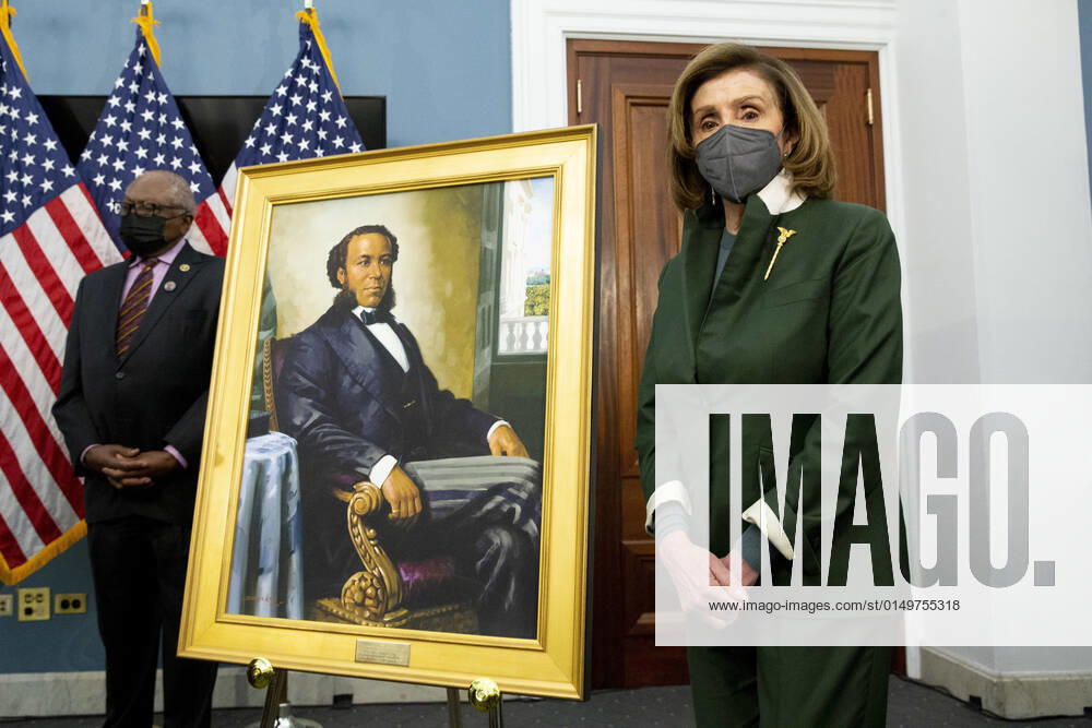 Speaker of the United States House of Representatives Nancy Pelosi (Democrat of California), right, stands beside a portrait of Joseph H. Rainey, as US House Majority Whip James Clyburn (Democrat of South Carolina), left, looks on during an unveiling ceremony for the Joseph H. Rainey Room, in the US Capitol in Washington, DC, USA, 03 February 2022. Former US Representative Joseph H. Rainey (Republican of South Carolina) was the first black person to serve in the United States House of Representatives Washington USA - ZUMAs152 20220203_zaa_s152_206