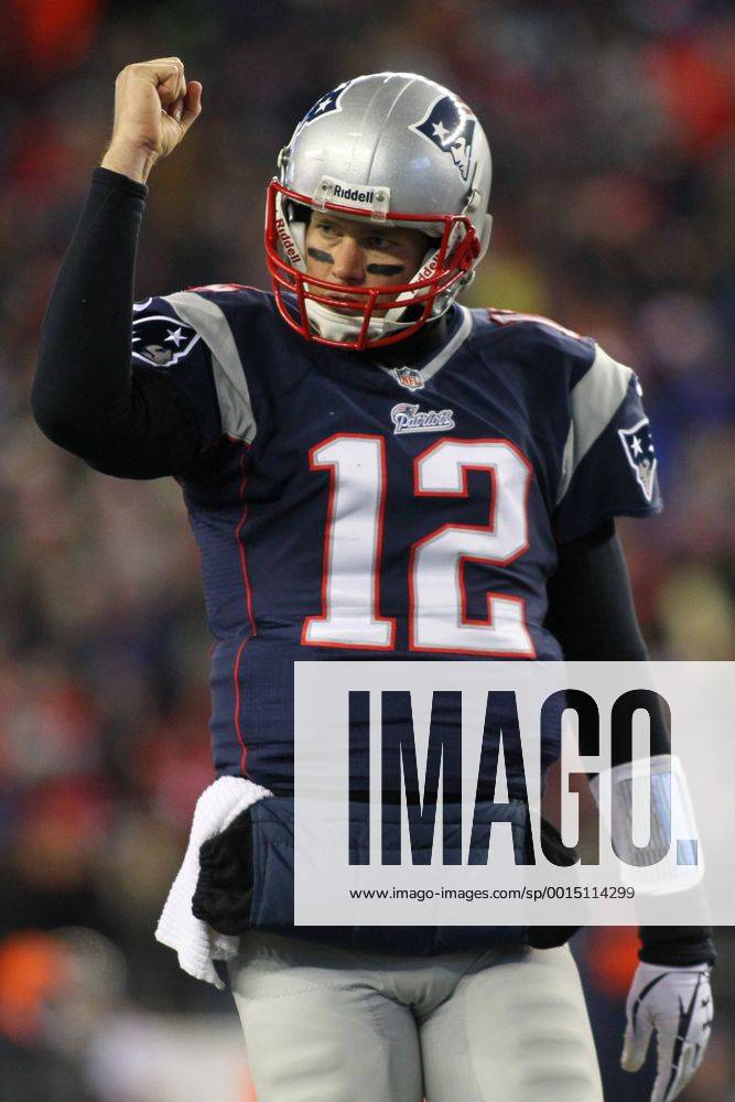 New England Patriots quarterback Tom Brady (12) pumps his fist after the Patriots scored on a one-yard carry by running back Brandon Bolden (not pictured) in the third quarter against the Denver Broncos in Foxboro, Massachusetts on November 24, 2013. The Patriots defeated the Broncos 34-31 in overtime. BOS2013112409