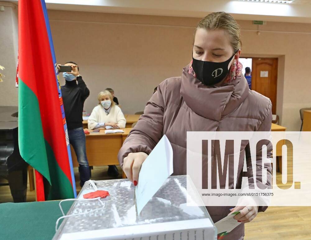 (220222) -- MINSK, Feb. 22, 2022 -- A voter casts her ballot at a polling station in Minsk, Belarus, Feb. 22, 2022. Early voting for a nationwide referendum on amending the country s constitution begins in Belarus on Tuesday and will last until Saturday. The referendum will be considered valid if more than half of the eligible voters cast their ballots. The question put on the ballot paper is: Do you accept amendments and additions to the Constitution of the Republic of Belarus? (Photo by Xinhua) BELARUS-MINSK-CONSTITUTION AMENDMENT-VOTING HenadzxZhinkov